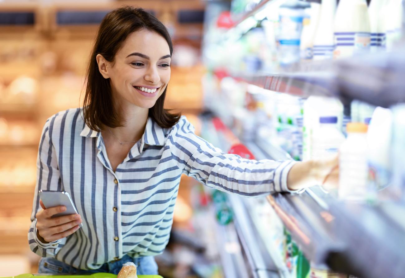 woman choosing an item from the shelf